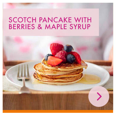 Scotch pancake with berries and maple syrup